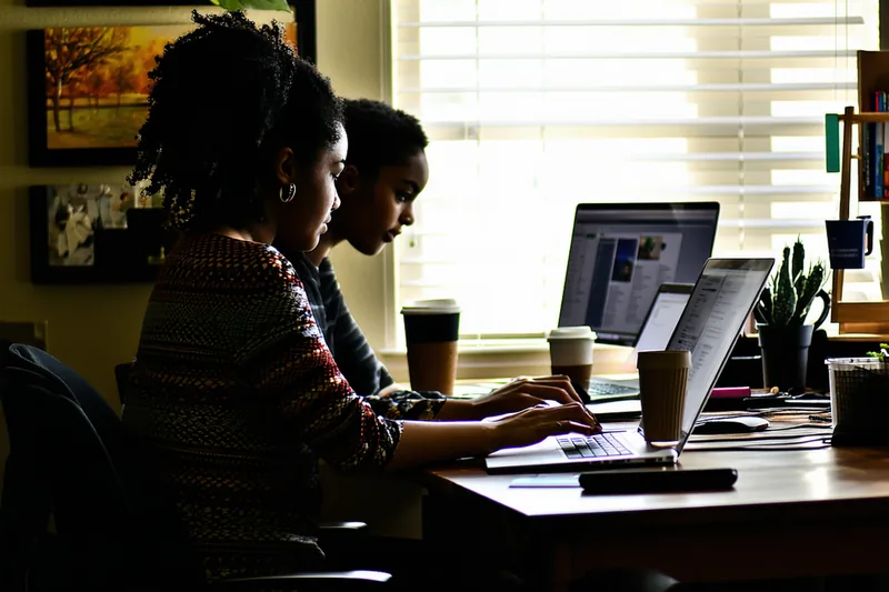 Two founders working together at a desk, Austin TX office setting